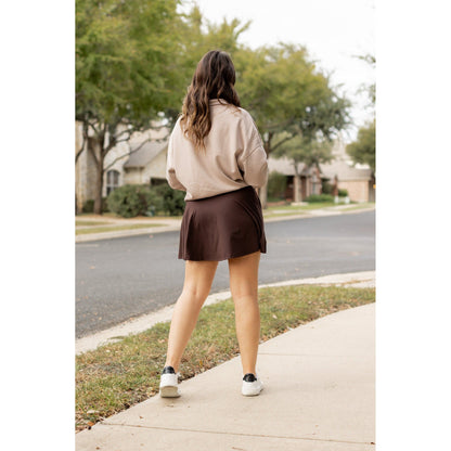Stretchy brown Julia Rose skort styled for casual wear